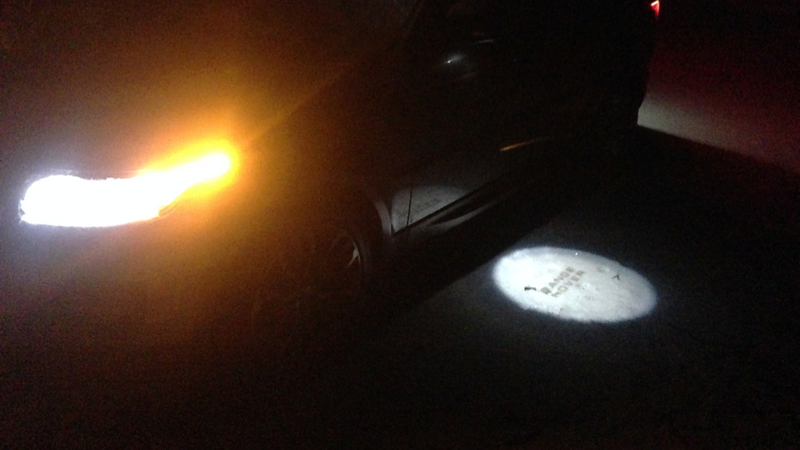 Illustration for article titled How Do We Feel About Decorative Puddle Lamps On Fancy Cars?